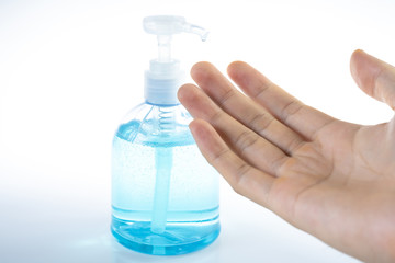 Man washing hands with sanitizer gel bottle or soap for coronavirus prevention, hygiene to stop spreading covid-19 (select focus)