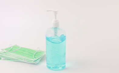 Protection of Coronavirus byAlcohol gel and mask on white background