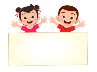 happy cute little kid boy and girl with blank banner