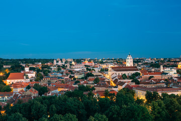 Vilnius, Lithuania. Night View Of Bell Tower And Church Of St. Johns, St. John The Baptist And St. John The Apostle And Evangelist In Old Town