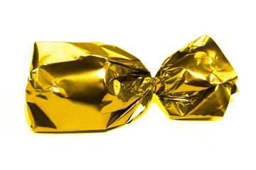 Gold candy wrapped isolated on white