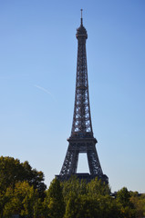 Fototapeta na wymiar Eiffel Tower straights up to the blue sky
