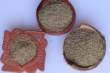 Ajwain seeds in bowl and wooden spoon