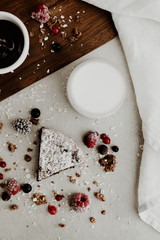 Obraz na płótnie Canvas Healthy vegan cake slice with chocolate sauce, milk and berries