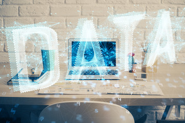 Double exposure of desktop computer and technology theme hologram. Concept of software development.