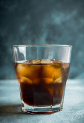 Black russian cocktail with ice and coffee liquor. Selective focus. Shallow depth of field.