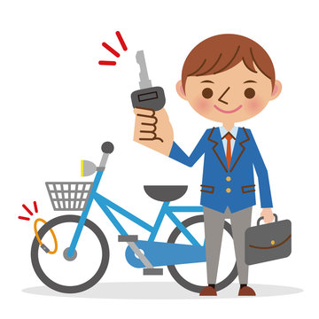 自転車にカギをかける男子学生