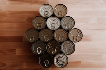 Canned food flat lay on wooden table