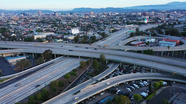 Aerial view of empty Los Angeles freeway and streets with no people and closed businesses in California as result of  coronavirus pandemic or COVID-19 virus outbreak and lockdown
