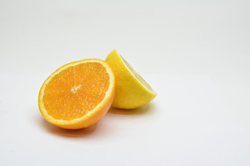 Naklejka na ściany i meble Lemon and orange isolated on white background. 