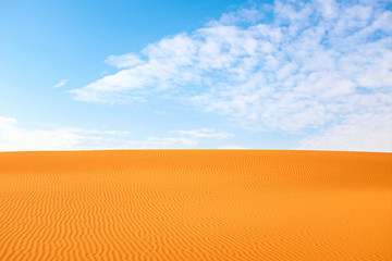 Saturated orange color desert sand and clear blue sky. Arabian Desert, Riyadh, Saudi Arabia