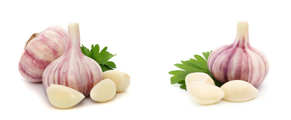 Garlic with leaves of parsley isolated on white