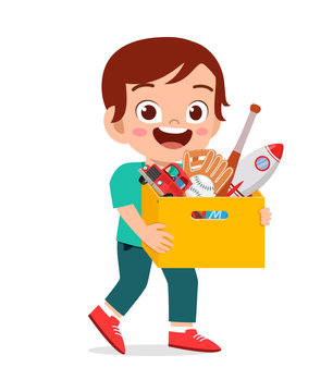 happy cute little kid boy carry box of toys