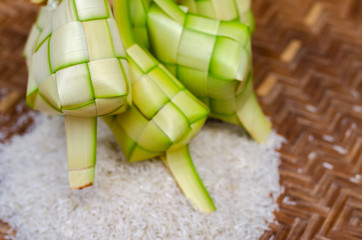 ketupat casing and rice in bamboo container. traditional malay delicacy during Malaysian eid festival