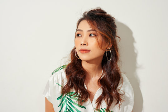 Serious Young Asian Woman Look Away In Tropical Shirt On White Background