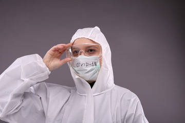 Woman in protective costume and mask 