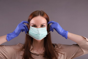 Woman teaching How to wearing Surgical mask for protect Covid-19 (coronavirus)