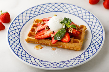 Fototapeta na wymiar sweet waffles with strawberry