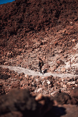Woman walking on the top of the Teide volcano in Tenerife, Spain