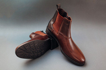 Shoes, chelsea leather boots for men. Male winter, autumn or spring fashion. Footwear on grey...