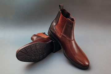 Shoes, chelsea leather boots for men. Male winter, autumn or spring fashion. Footwear on grey background. Sale