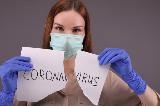 Nurse Tears Sheet Of Paper With Sign 