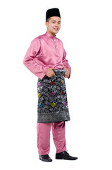 Portrait of young muslim with malaysian traditional attire called baju melayu standing against white background - 333665505