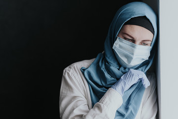 tired medical worker doctor woman muslim woman in hijab after taking a large number of patients due to epidemic of coronavirus