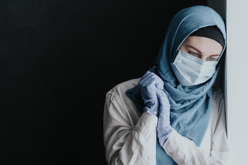 tired medical worker doctor woman muslim woman in hijab after taking a large number of patients due to epidemic of coronavirus