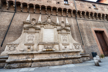 Fontana Vecchia or della Gabella Vecchia (1565) and Accursio Palace, Town hall. Old marble fountain by the Sicilian architect and painter Tommaso Laureti in Bologna downtown, Emilia-Romagna, Italy