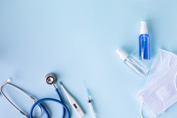 medical concept on a blue background. stethoscope, pills, tablet, notepad, sheet of paper, pen....
