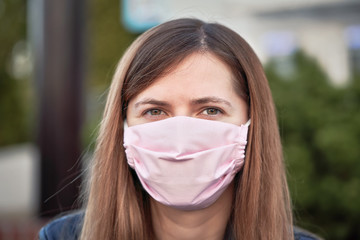 Young woman with hand made face nose mouth mask portrait, can be used during coronavirus covid19...