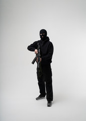 Man in mask With gun on white background