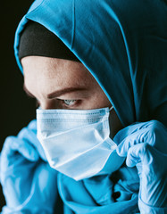 a doctor, a Muslim woman in a hijab and a protective medical bandage, was tired after taking a large number of patients as a result of the outbreak of the coronavirus