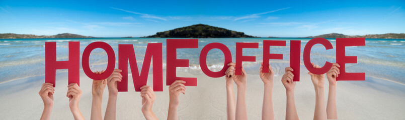 People Hands Holding Colorful English Word Homeoffice. Ocean And Beach As Background