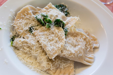 A dish of Tortelloni with parmesan, sage and butter