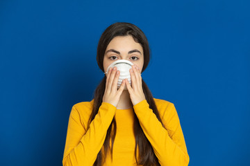 Brunette young girl wearing yellow jersey