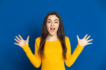 Brunette young girl wearing yellow jersey
