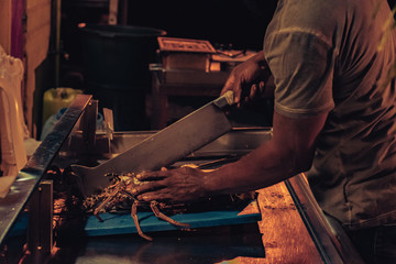 man preparing lobster