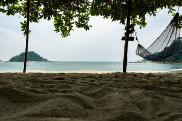 empty hammock for relaxing at the beach during summer vacation at Pangkor Island located in Perak State, Malaysia