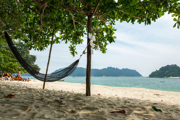 empty hammock for relaxing at the beach during summer vacation at Pangkor Island located in Perak State, Malaysia