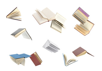 Old hardcover books flying on white background