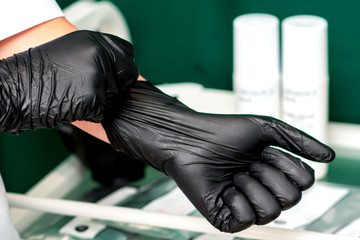 Medical latex gloves on hands.