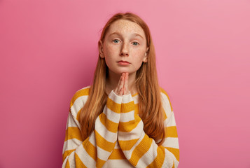I am sorry! Pleading ginger girl keeps palms pressed together, begs parents for forgiveness, asks...