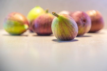 Fresh figs (Ficus carica L.) on lighted background