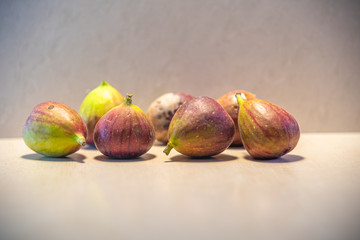 Fresh figs (Ficus carica L.) on lighted background