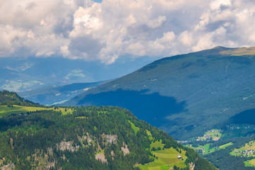 View of a valley with forest on the mountain slopes