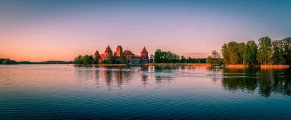 Fototapeta na wymiar Beautiful spring sunset over the lake and Trakai Castle, Lithuania
