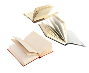 Old hardcover books flying on white background