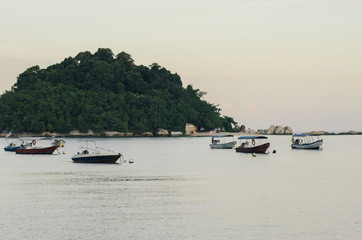 Fototapeta na wymiar group of speed boat for island hoping activities moored on the Nipah Bay pangkor Island, Malaysia